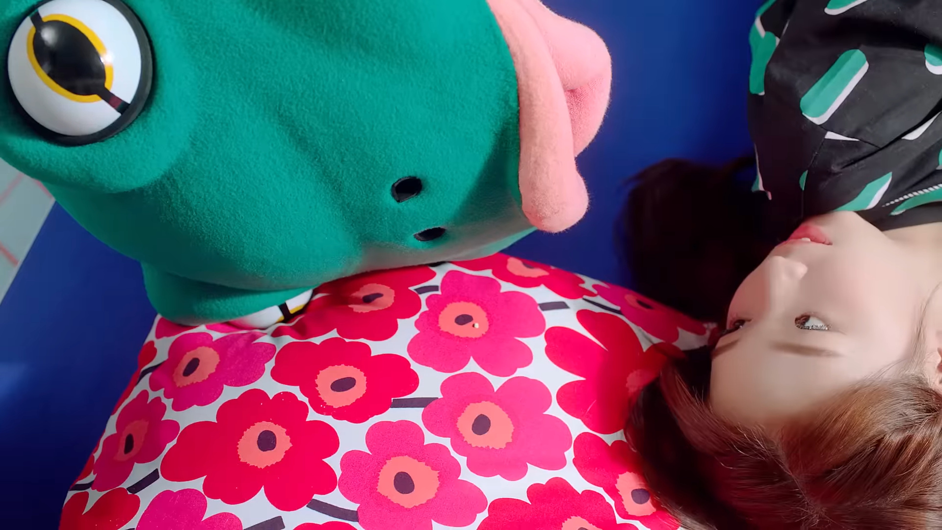 The frog laying next to Yeojin in bed.